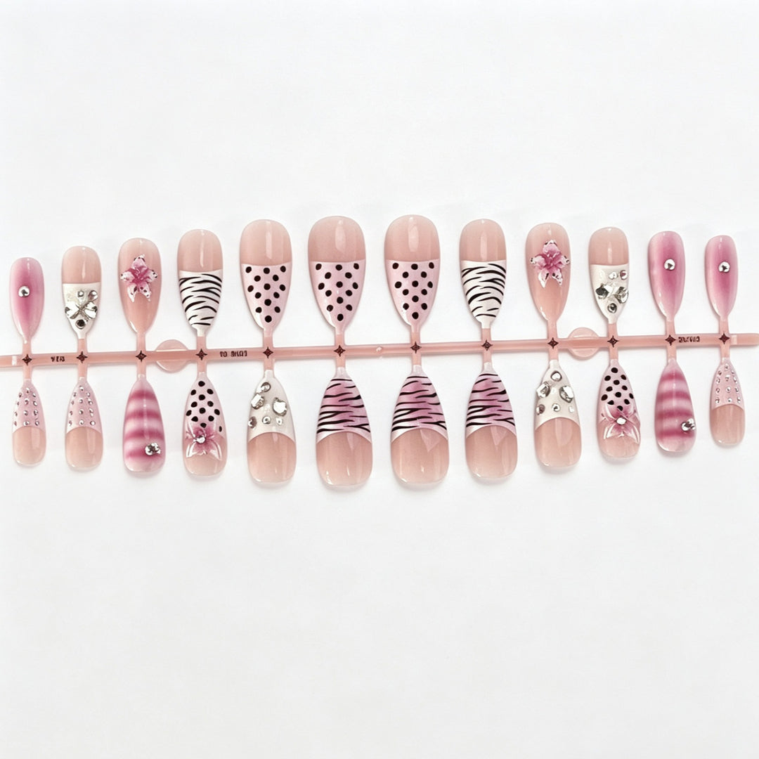 Artistic Press-On Nail Design with Unique Patterns and Rhinestone Accents Bowlift