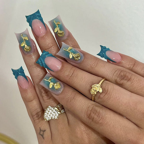Elegant artificial nail creations with golden embellishments Bowlift