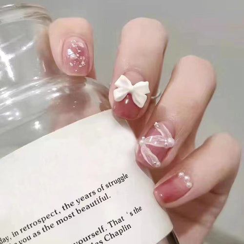 Creative art nails with bows and pearl coating Bowlift