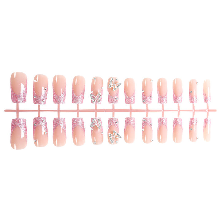 Acrylic nail set with sparkling glitter accents and elegant butterfly motifs Bowlift