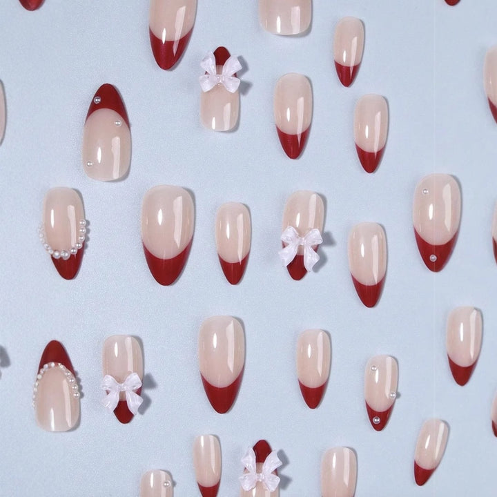 Artificial nail set with glamorous rhinestone and bow decorations Bowlift