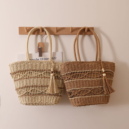 Handcrafted straw tote bag with decorative tassel detail Bowlift
