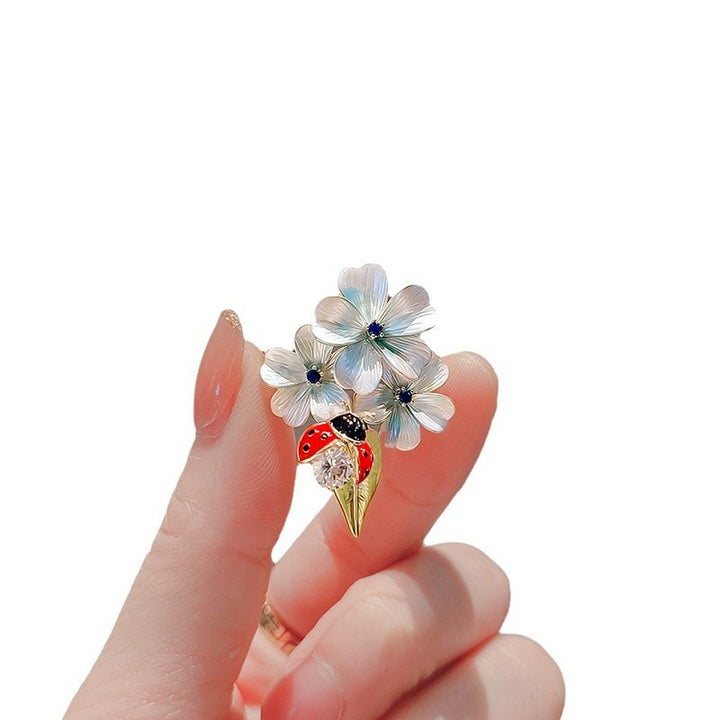Flower brooch with ladybug and crystal Bowlift