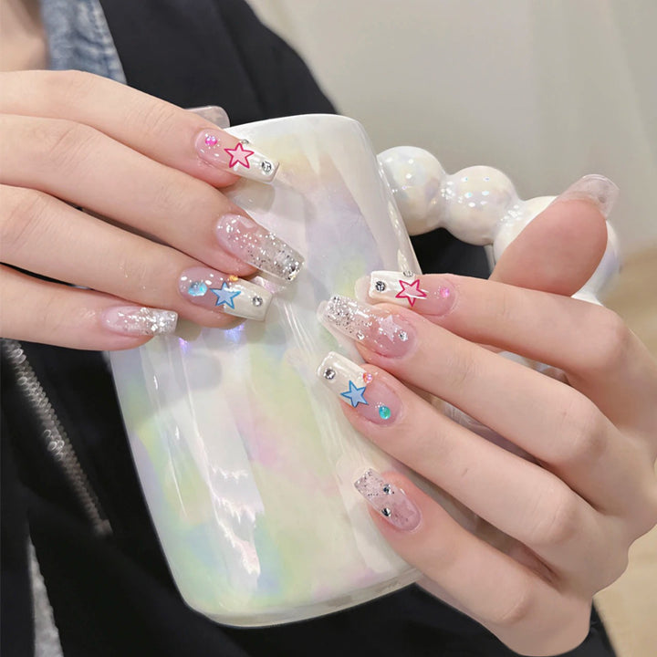 Glamorous artificial fingernails with glitter and moon designs Bowlift