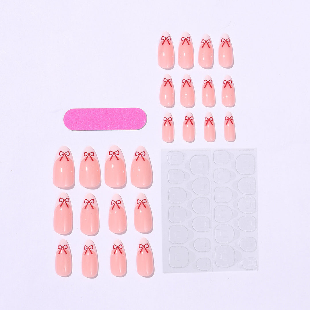 Artificial nail set with playful bow design Bowlift