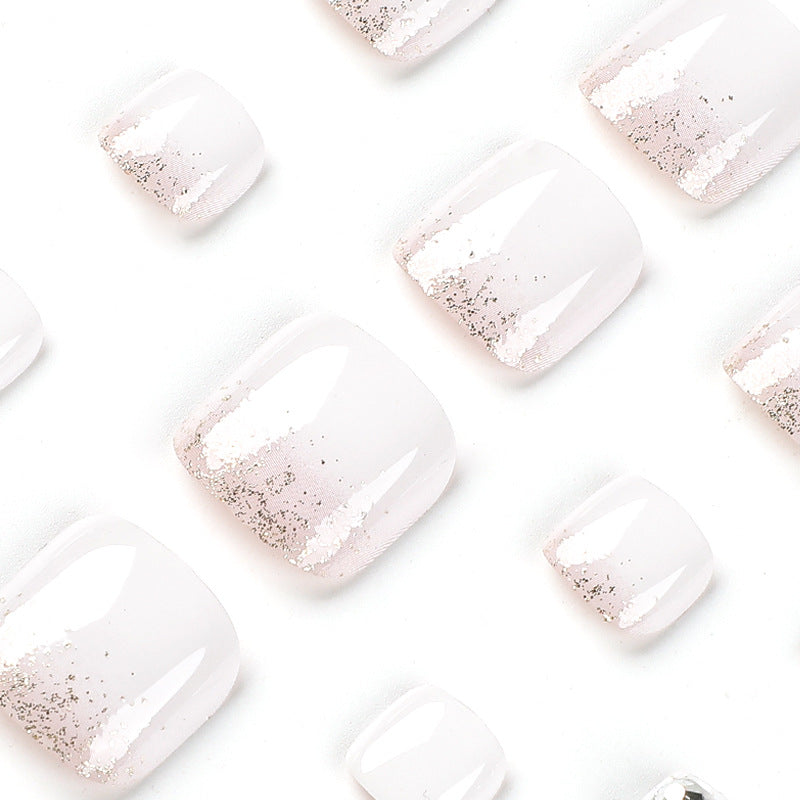 Artful toenail design with sparkling embellishments Bowlift