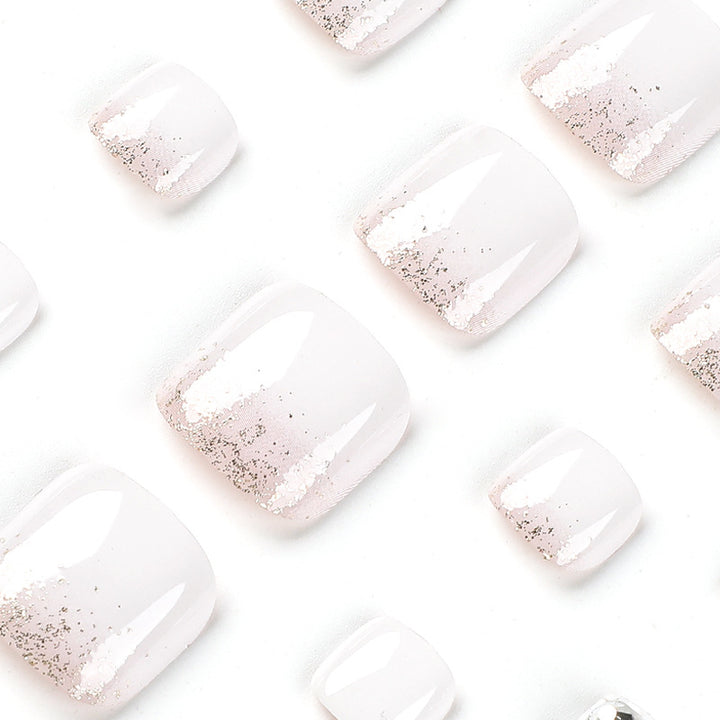 Artful toenail design with sparkling embellishments Bowlift