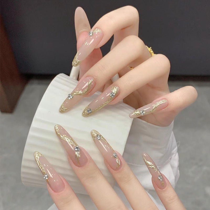 Artificial nail set with elegant gold design and sparkling applications Bowlift