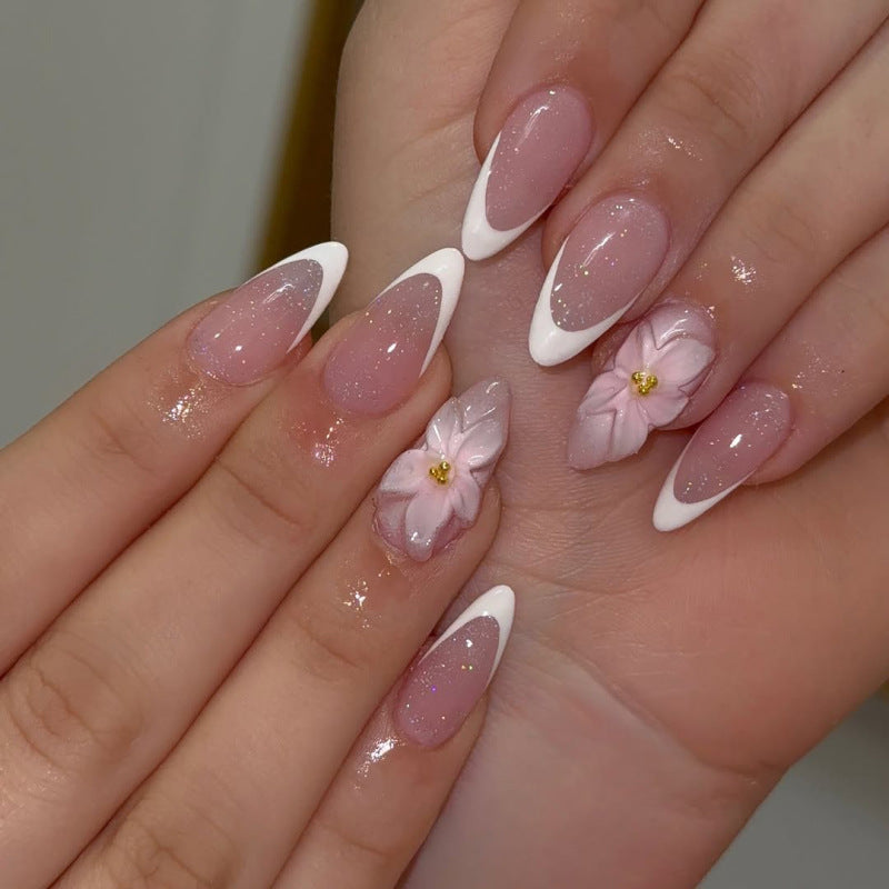 Artistic French-Tip Nail Extensions with Flower Accents Bowlift