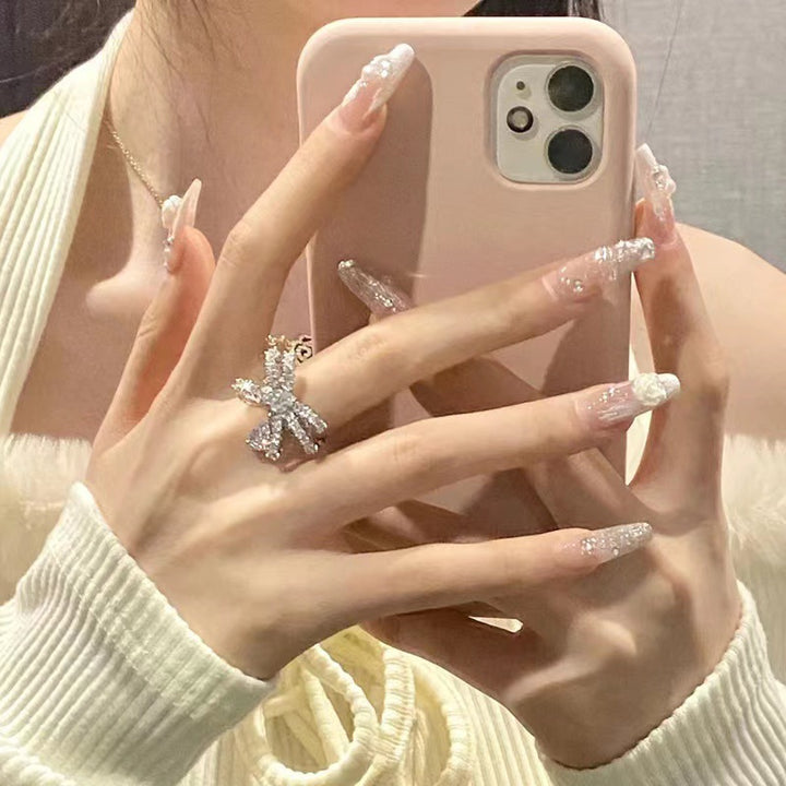 Elegant artificial nails with glitter and flower decoration Bowlift