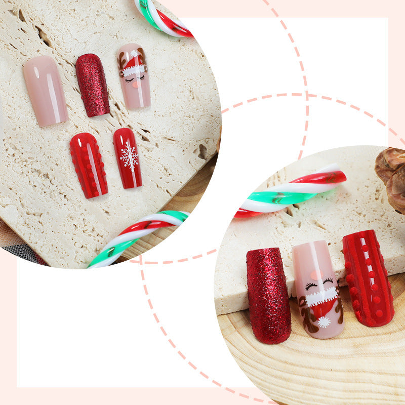 Artificial nail set with festive Christmas designs and glitter accents Bowlift