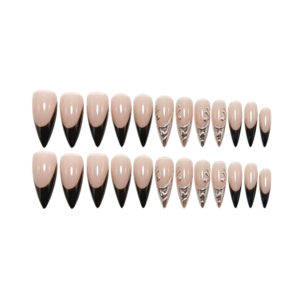 Artificial nails in elegant stiletto style with elaborate metal decoration Bowlift