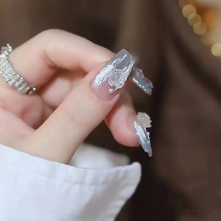 Artificial nail set with delicate rose and glitter decorations Bowlift