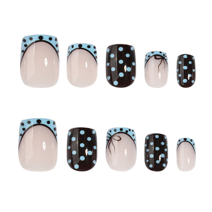 Artful nail extensions with playful dots and elegant design Bowlift