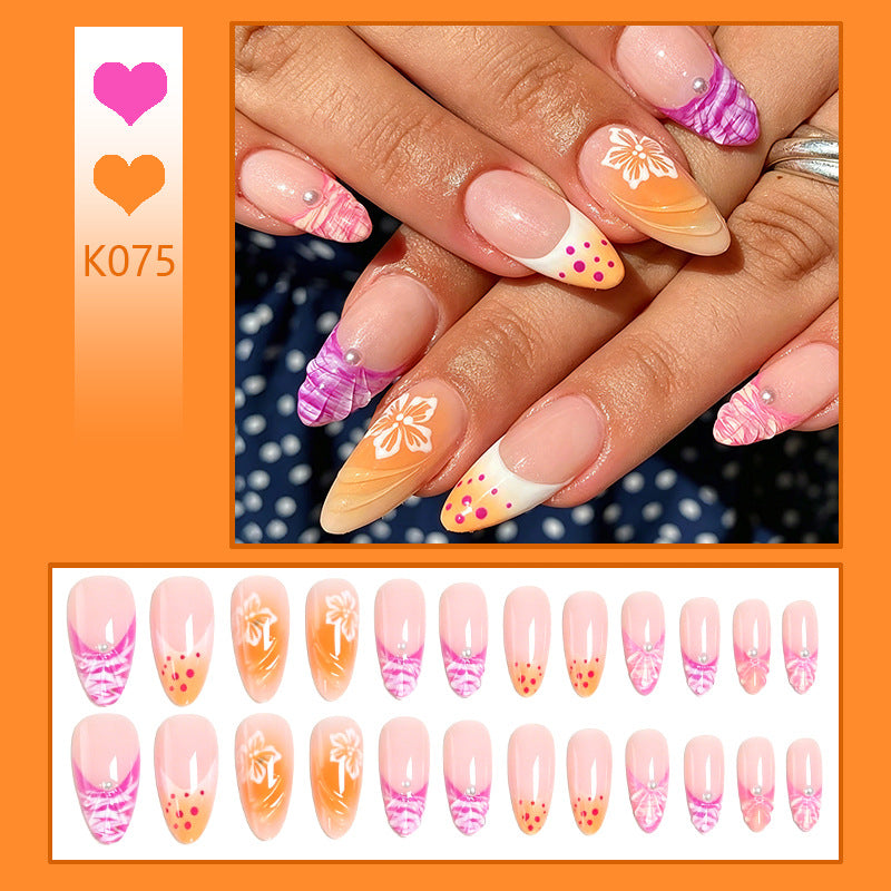 Acrylic nail set with exotic flower patterns and glitter accents Bowlift