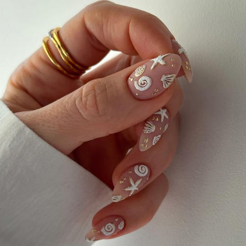 Artful nail design with maritime motifs Bowlift