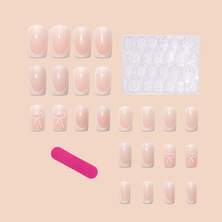 Nail art set with elegant bow and glitter accents Bowlift