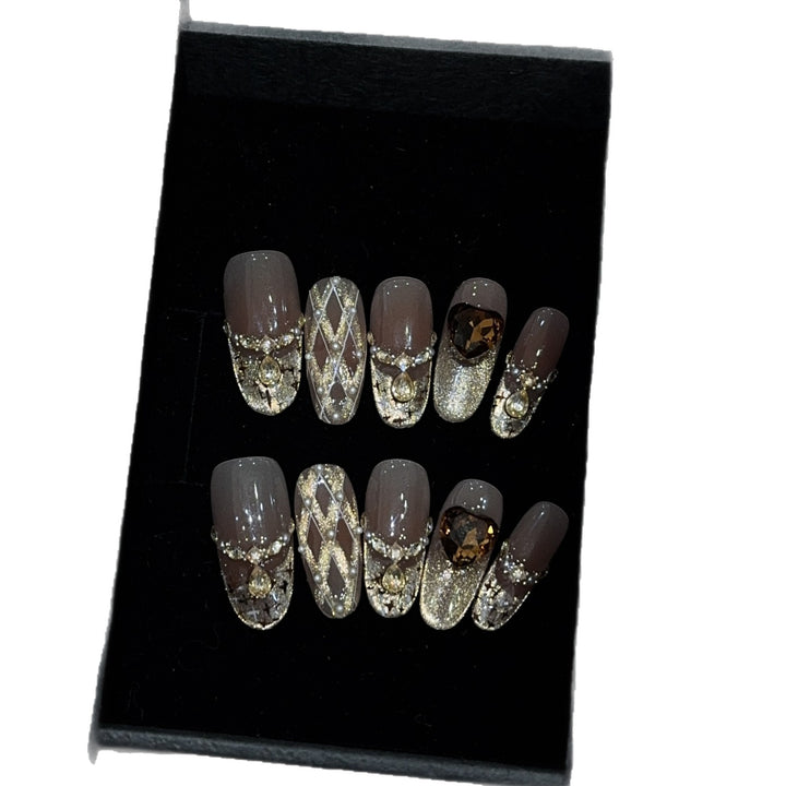 Glamorous artificial nails with glitter and heart design Bowlift