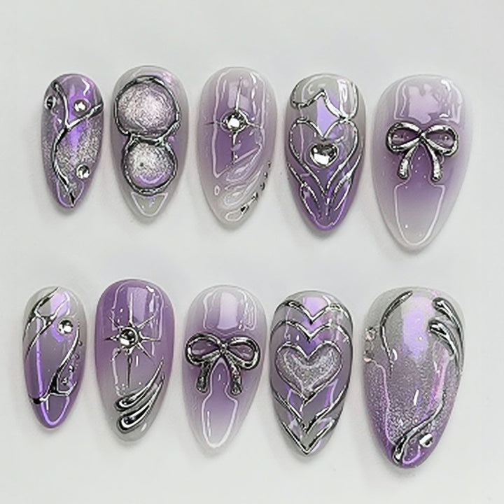 Acrylic nail set with elegant ombre design and delicate embellishments Bowlift