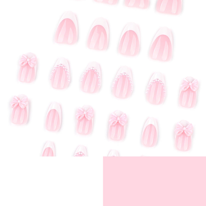 Artful Stiletto Nails with Delicate Bow Accents Bowlift