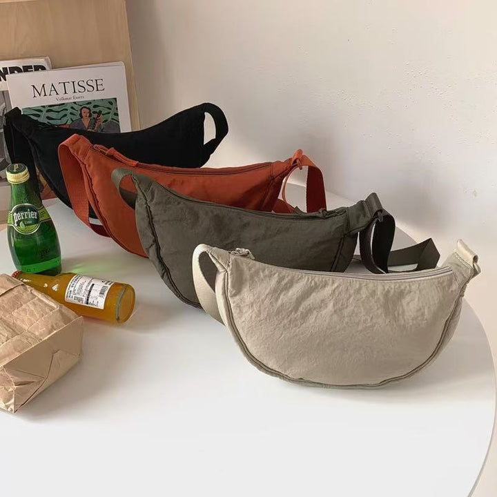 Shoulder bag with practical compartment system and adjustable shoulder strap Bowlift