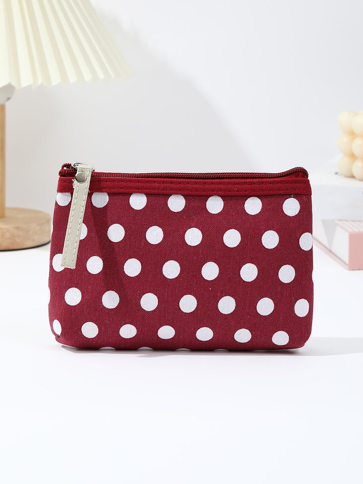Polka dot canvas cosmetic pouch with top zipper and leather pull Bowlift