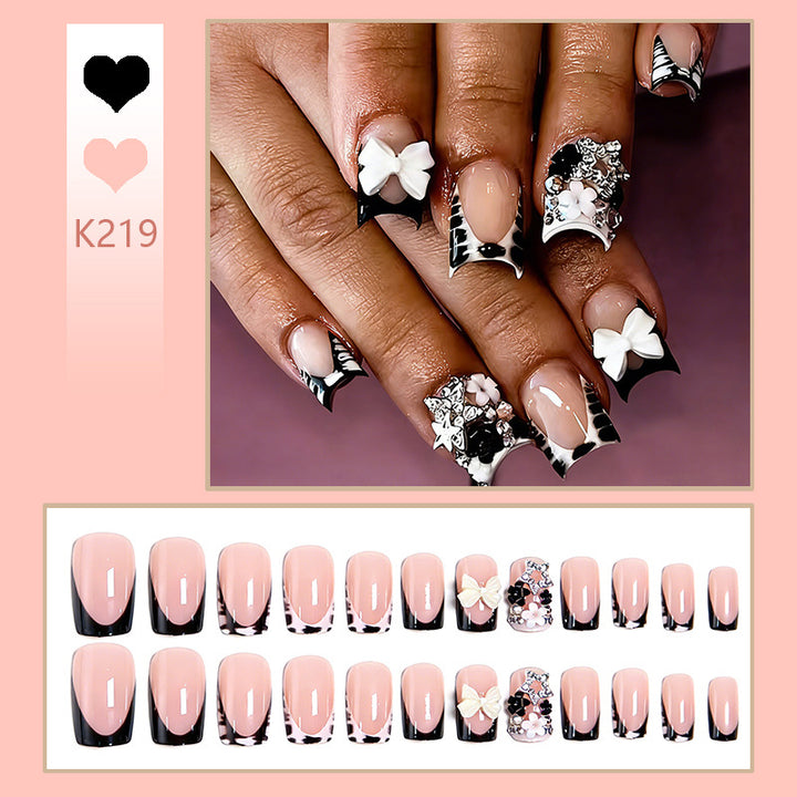 Artificial nail design with elaborate 3D decorations Bowlift