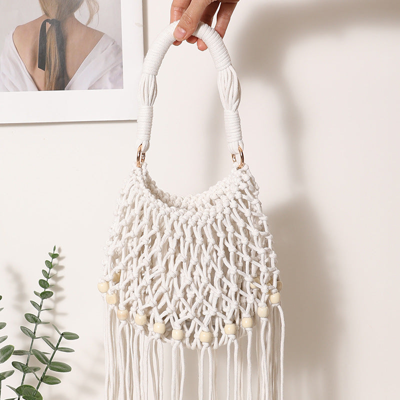 Macrame bag with decorative fringes and wooden beads Bowlift