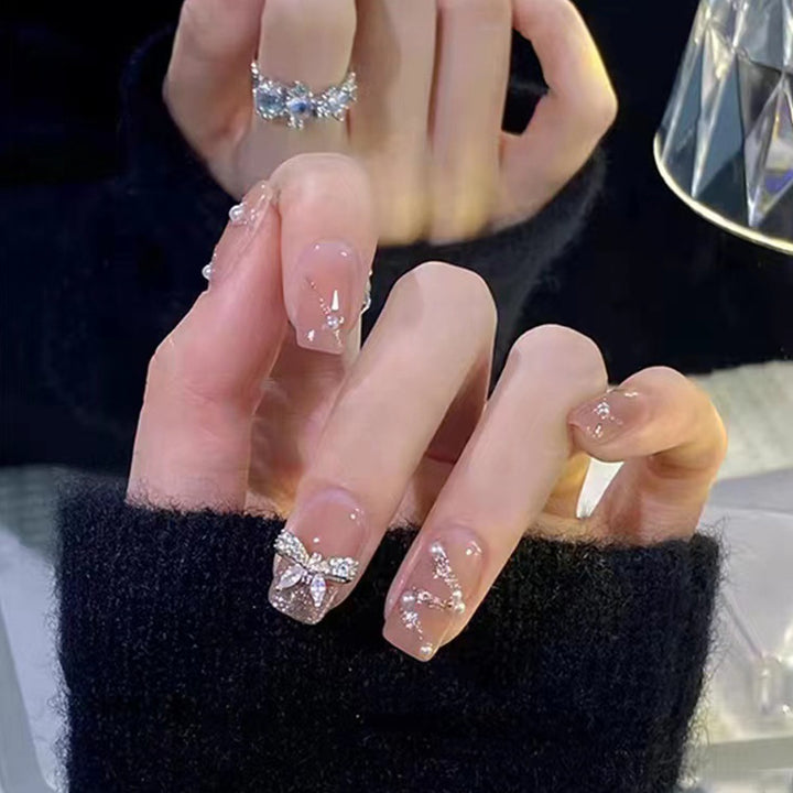 Artificial nails in an elegant design with 3D butterflies and glitter accents Bowlift