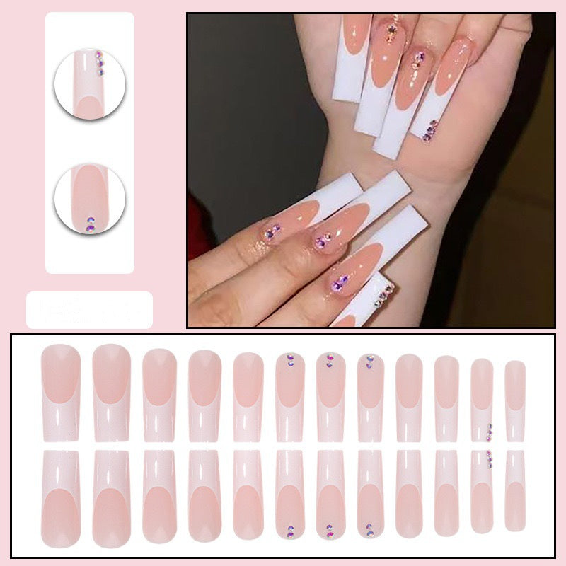 Nail set with elegant French tips and sparkling rhinestone embellishments Bowlift