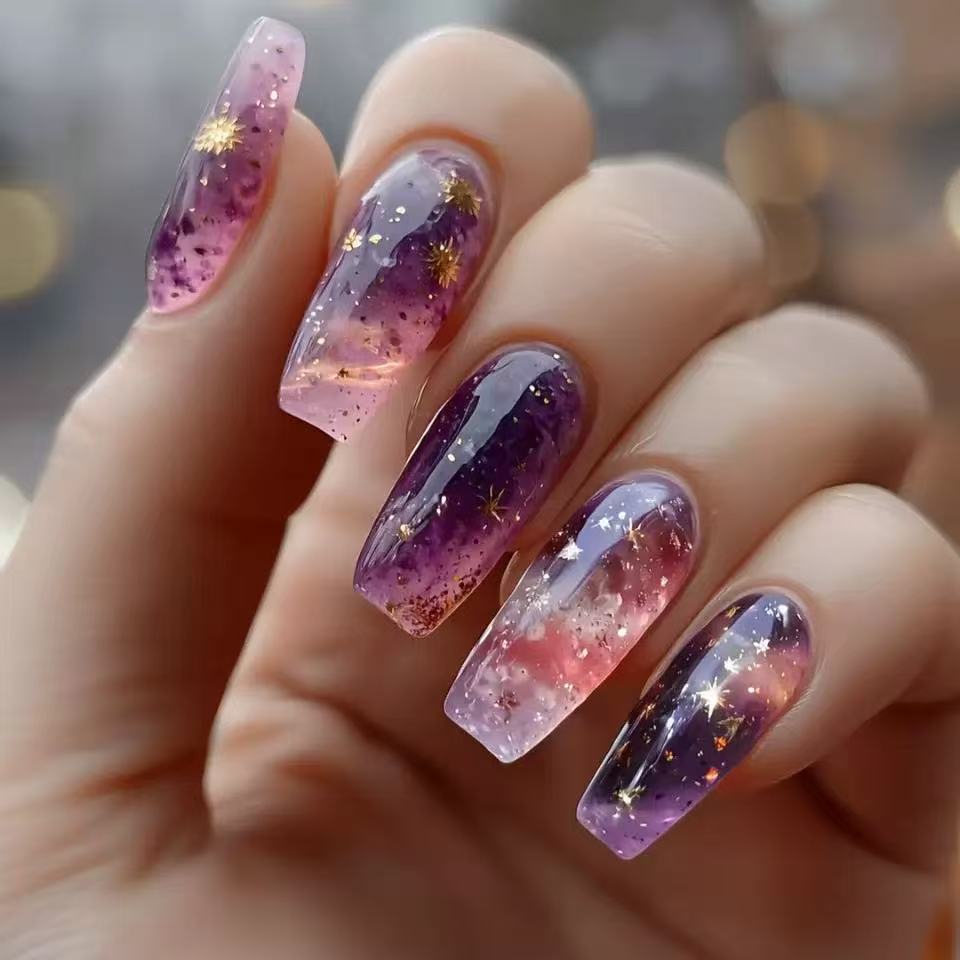 Glittering artificial nail tips in galaxy design Bowlift