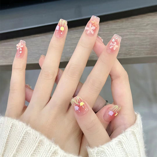 Artificial nails with floral design and glitter effects Bowlift