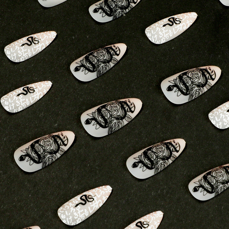 Artful nail extensions in elegant stiletto style with artistic floral and graphic designs Bowlift