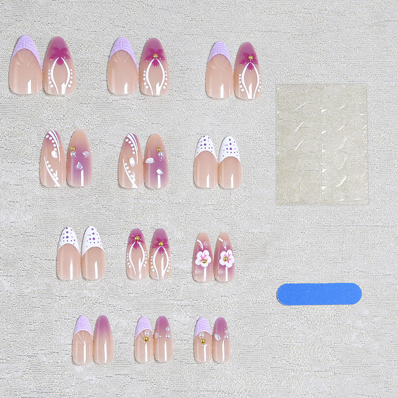 Artificial nail set with exotic floral and glitter accents Bowlift