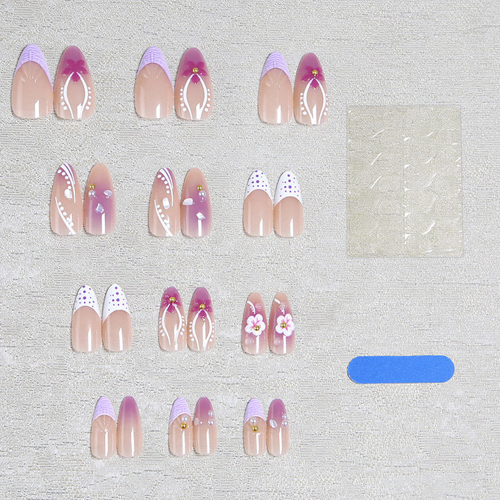 Artificial nail set with exotic floral and glitter accents Bowlift