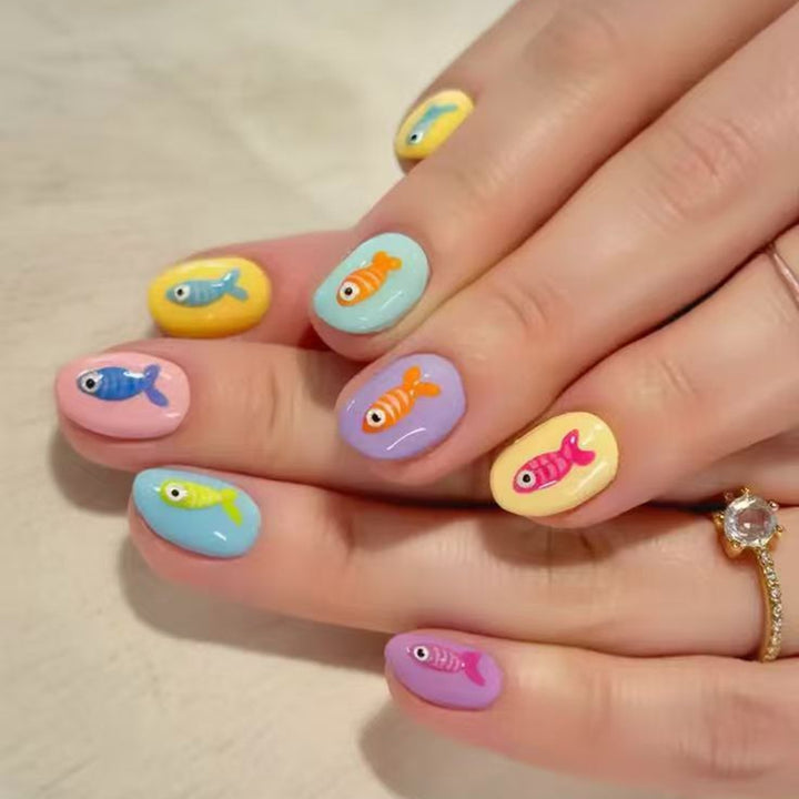 Creative artificial nails with playful fish design Bowlift