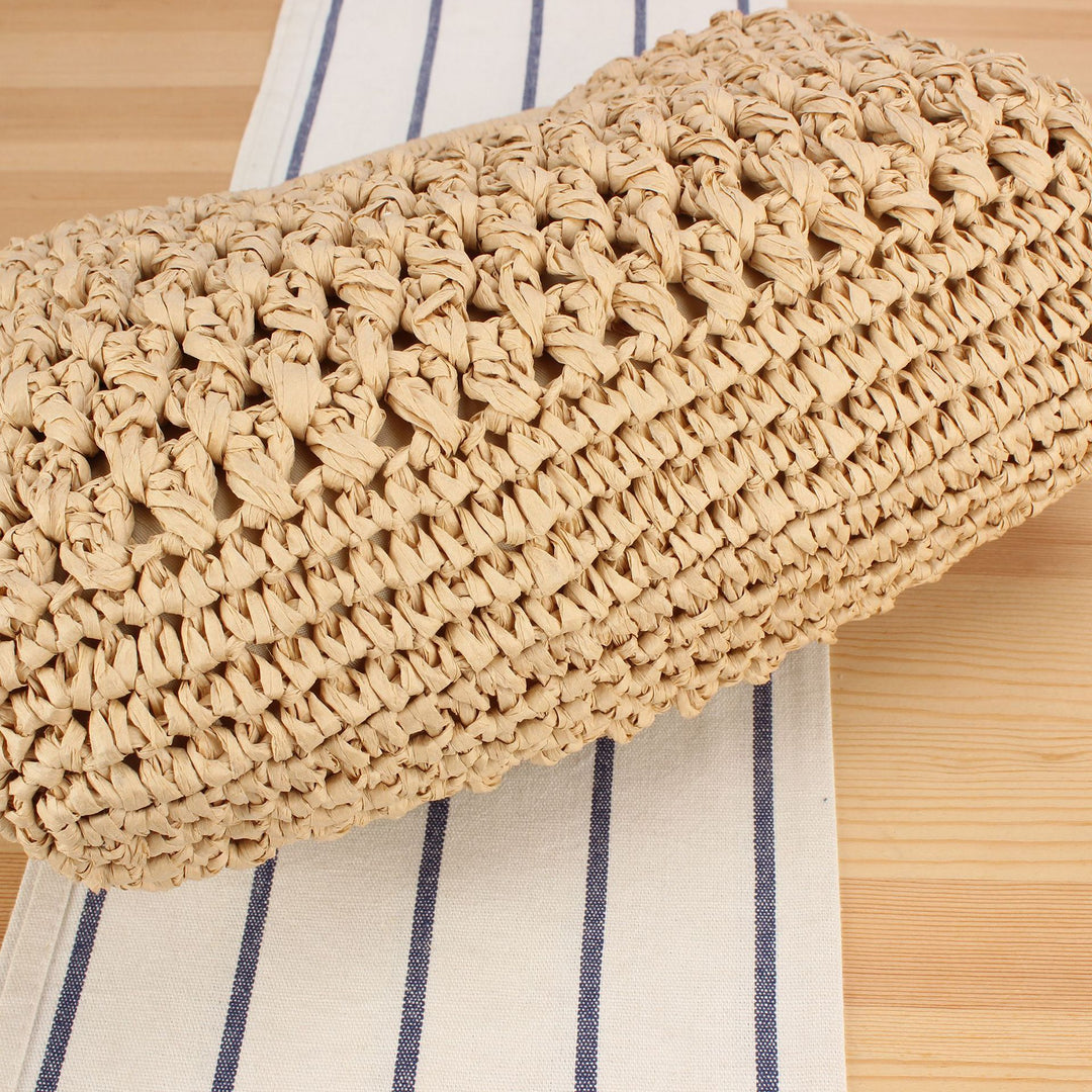 Fine straw shoulder bag with elegant chain accents Bowlift