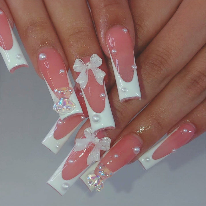 Artificial nail set with elegant 3D bows and glitter accents Bowlift