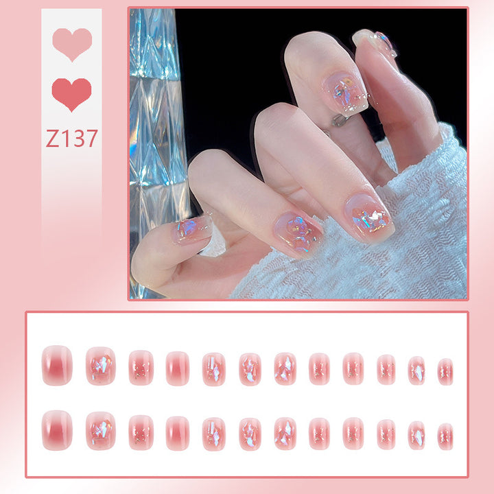 Nail art set with elegant wave patterns and delicate pearl accents Bowlift