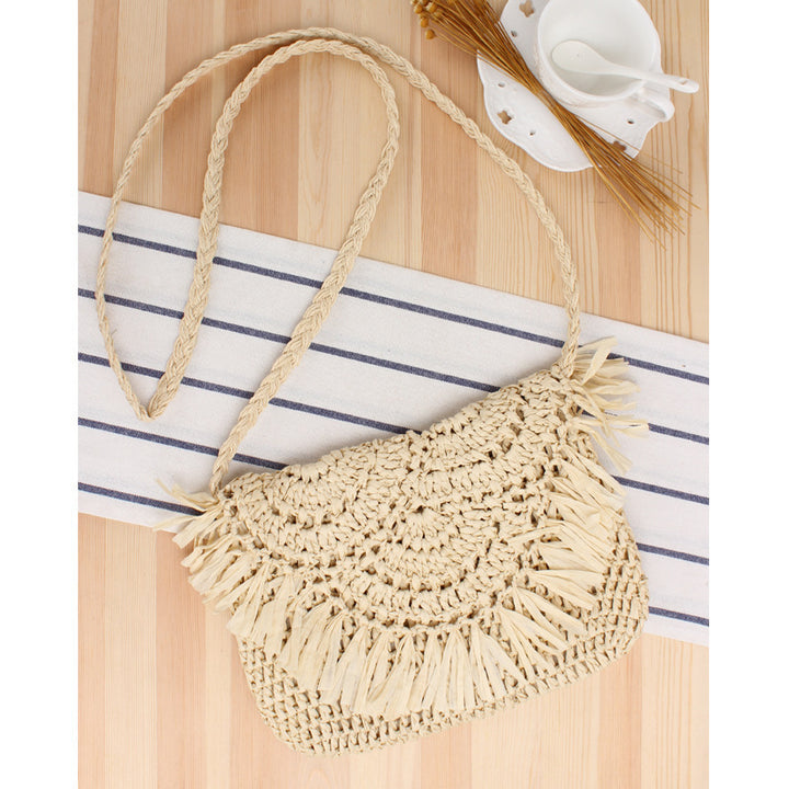 Handcrafted macrame shoulder bag with fringed design Bowlift