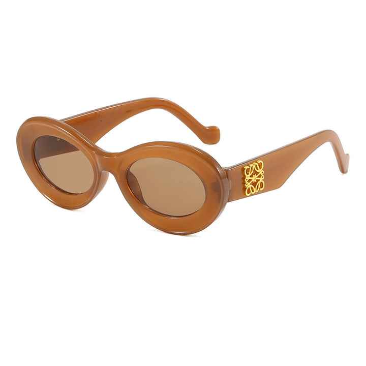Women's fashionable sunglasses with oval frame and golden applications Bowlift