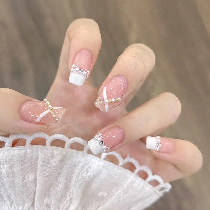 Artificial nails with heart design and glamorous accents Bowlift