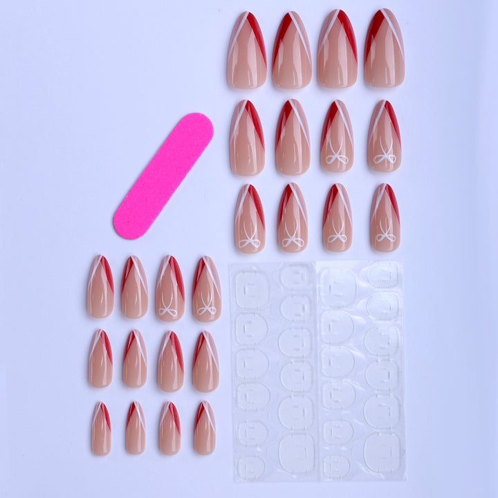 Artificial nails in elegant stiletto design with bow accents Bowlift