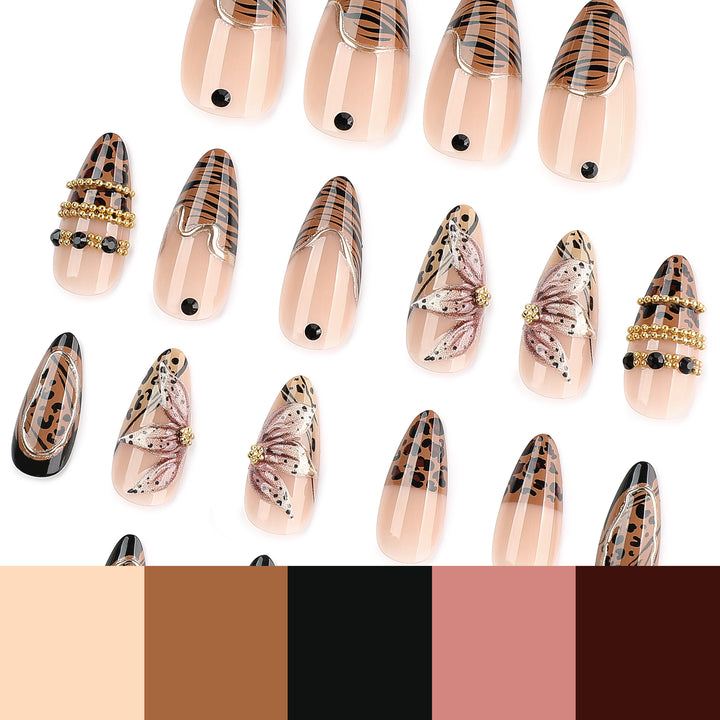 Artful stiletto nail with floral accents and gold embellishments Bowlift