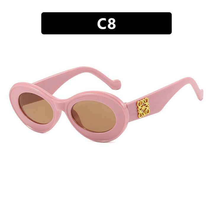 Women's fashionable sunglasses with oval frame and golden accents Bowlift