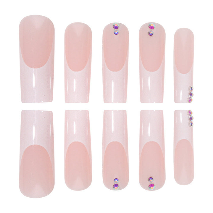 Nail set with elegant French tips and sparkling rhinestone embellishments Bowlift