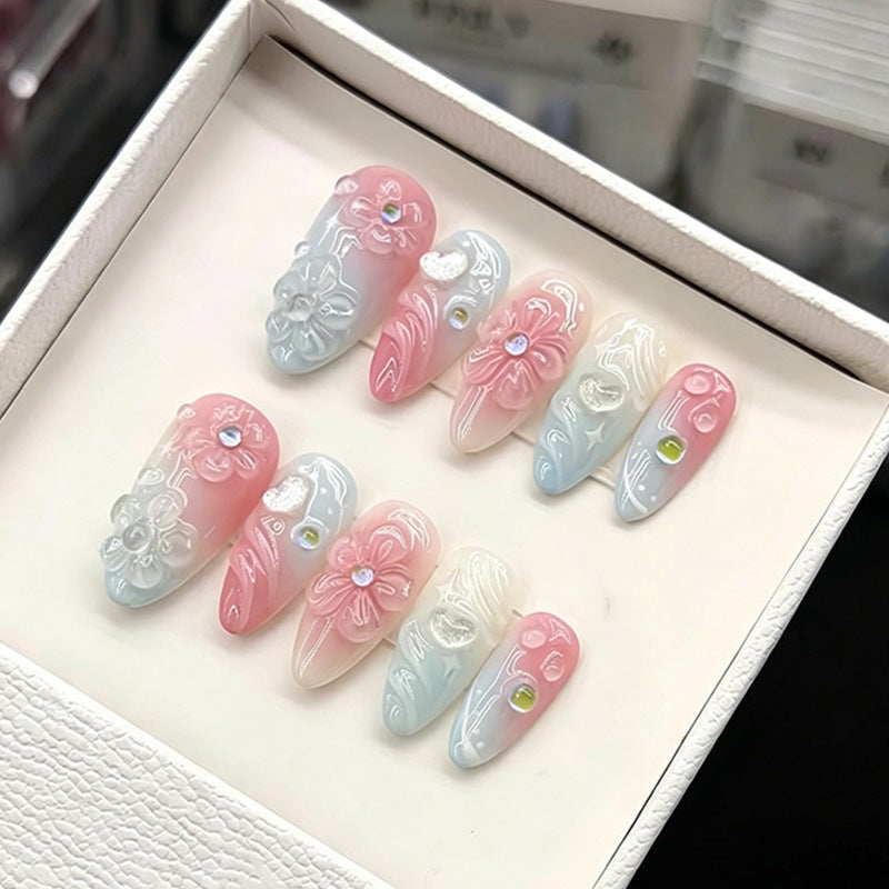 Acrylic nail set with elegant ombre design and floral decorations Bowlift
