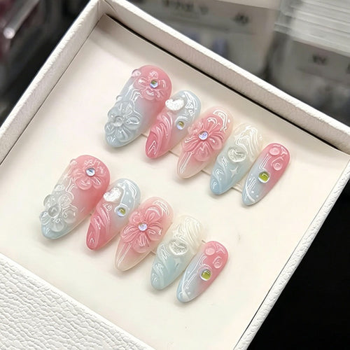 Acrylic nail set with elegant ombre design and floral decorations Bowlift