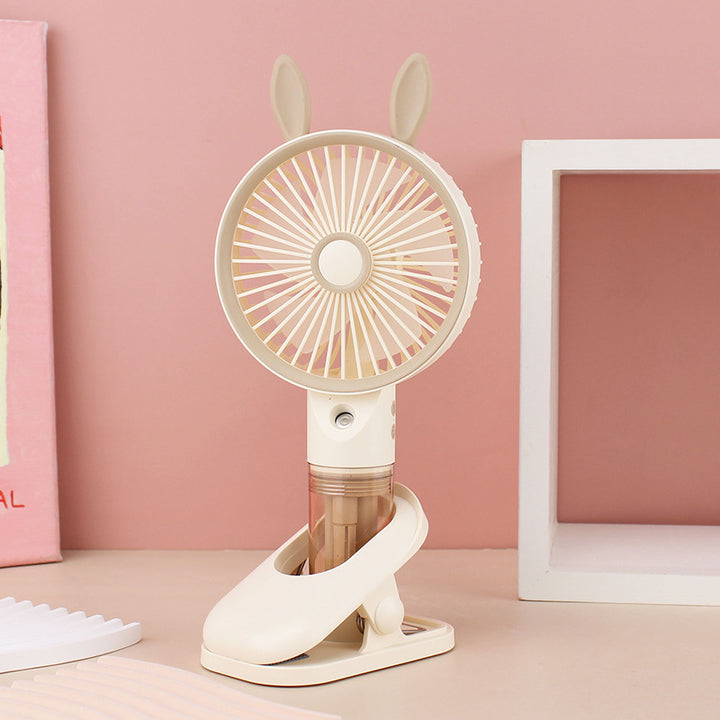 Cooling compact rechargeable clip-on misting handheld fan with detachable water reservoir and adjustable tilt Bowlift