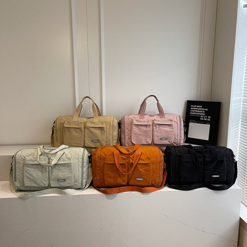Sporty Travel Bag With Several Exterior Pockets Bowlift